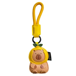 Cute leather capybara keychain with lemon fruit hat and yellow strap bag pendant charm accessory