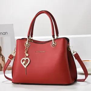 Red stylish shoulder bag for women with elegant heart charm, large capacity PU leather handbag.