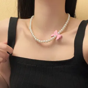 Elegante parel choker ketting met een schattige roze strikhanger voor dagelijks gebruik.