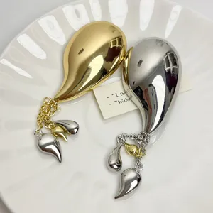 French retro metal smooth streamlined chili tassel brooch, exquisite suit clothing accessory.