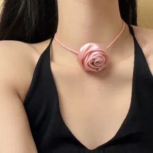 Detailed view of the pink fabric rose choker necklace, elegant floral neck jewelry.