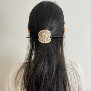 Chinese style hair stick with purple enamel gold magpie plum blossom detail for elegant bun.