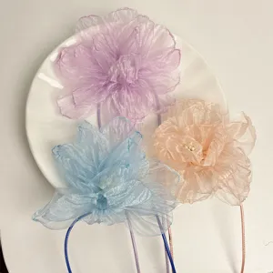 Detail view of handmade organza flower choker necklaces in soft pastel colors, perfect fairy style.