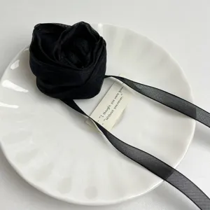 Black fabric rose flower choker necklace for women, elegant ribbon collar jewelry gift.