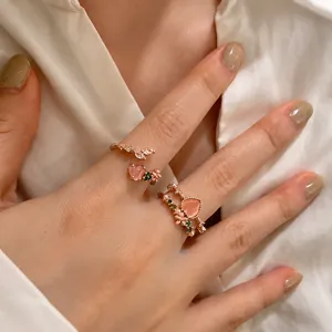 Closeup detail of the sweet double-layer heart zircon open ring with floral and leaf accents.