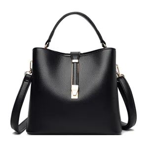 Black PU leather shoulder bag for women, stylish tote handbag with top handle and gold hardware.