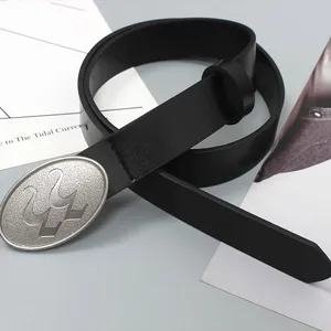 Stylish black leather belt featuring a unique silver oval metal buckle, detailed close-up.