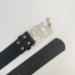 Detailed view of the Y2K vintage gothic letter buckle litchi pattern leather belt.