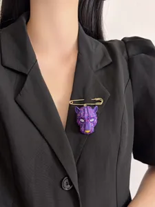 Detailed view of a stylish purple leopard head brooch pin, perfect for elegant suit lapels.