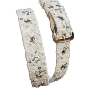 White denim belt detail, star grommets and sequins close up for y2k punk style daily outfit