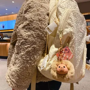 Cute plush capybara keychain fluffy pompom doll bag pendant for adorable daily backpack decor.
