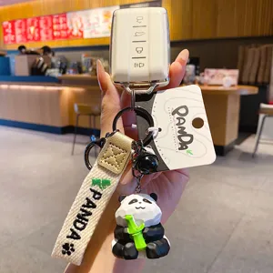 Cute resin panda keychain with car key cover and strap pendant for bags and keys.
