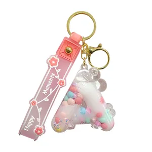Schöner flüssiger Buchstabe A Schlüsselanhänger mit bunten Perlen und rosa Band für Damen.