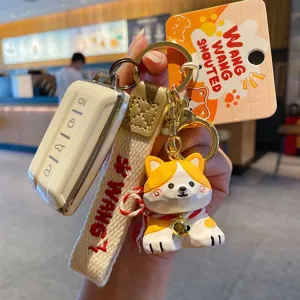 Cute dog keychain with strap and car key cover, stylish bag charm and fashion accessory.