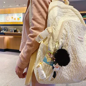 Crinkled beige school backpack with cute cat plush keychain for women fashion daily use