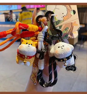 Cute fluffy dog keychain pendant set with braided rope and resin puppy figures for bags and keys.