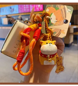 Cute Shiba Inu keychain with braided strap and resin dog doll pendant for keys.