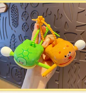 Close-up detail of cute mini wooden fish decompression toy keychain, cartoon animal design