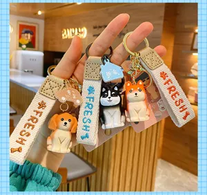 Niedlicher Hund Schlüsselanhänger aus Harz mit Stoffband und kreativen Tiermotiven für Taschen.