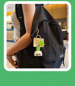 Detailed view of cute panda bamboo resin keychain charm, perfect backpack pendant and accessory.