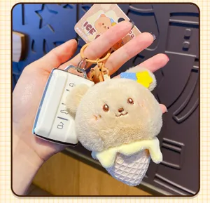 Fluffy ice cream bear keychain detail, cute plush bag charm and key ring accessory.