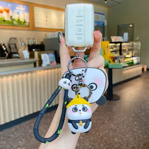 Cute cartoon panda keychain car key cover with adorable doll pendant and strap for backpacks bags.
