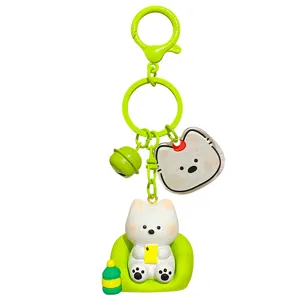 Cute cartoon white dog keychain with green chair and bell pendant stylish bag charm accessory
