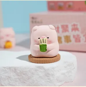 Cute resin zen pig figurine holding lucky bamboo cup, perfect desktop and car interior decor.