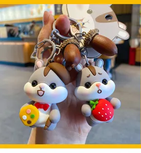 Mignon porte-clés hamster de dessin animé avec pendentifs glands et fruits mignons.