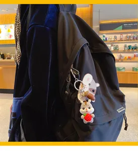 Adorable porte-clés hamster de dessin animé, accessoire élégant pour sac et clés de voiture.