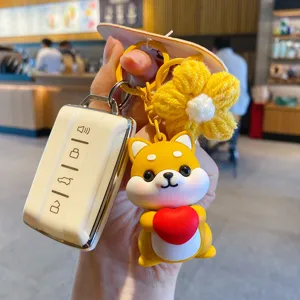 Schattige cartoon Shiba Inu sleutelhanger met rood hart, gele gebreide bloem en tas