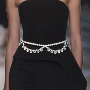 Close-up detail of the elegant double-layer pearl and crystal drop waist chain body jewelry.