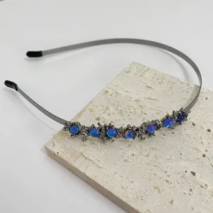 Cerchietto per capelli in metallo stile punk con pietra di luna, accessorio unico e alla moda.