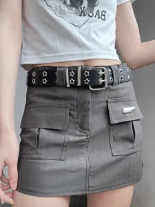Punk style double row grommet belt with star cutouts and metal double pin buckle fashion accessory.