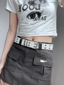 Punk style white double grommet belt with star eyelets, trendy waist accessory for women.