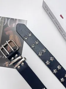 Women punk style leather belt with star eyelets and double prong buckle for daily fashion wear.