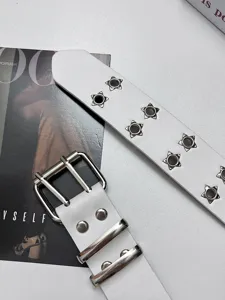 Stylish white leather punk belt featuring double star grommets and silver double prong buckle.