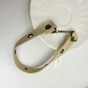 Punk style canvas choker necklace for women, vintage washed design with metal grommets.