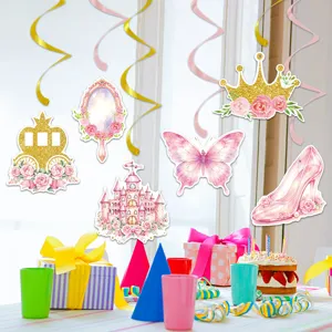 Princess castle birthday party decoration set with hanging swirls, cake toppers and pink items.