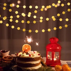 Gold round paper garland string for party, wedding and birthday decoration scene detail view.