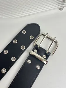 Punk style black leather belt with double grommet eyelets and metal pin buckle for daily wear.
