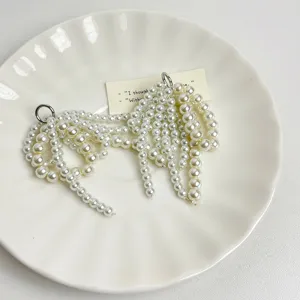 Pearl bow shoe charms for sneakers, elegant beaded shoe clips for women decoration.