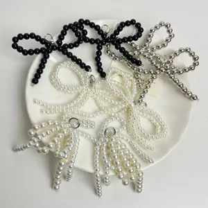 Pearl bow shoe clips and charms, stylish decorative accessories for sneakers and footwear.