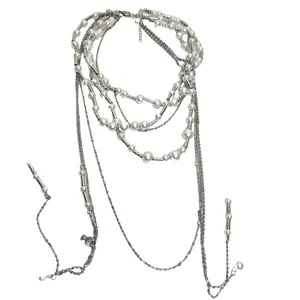 Vintage multi-layer pearl necklace with bamboo chain and long tassel design for women.