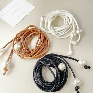 Detailed view of multi-color leather rope pearl waist chain, adjustable chic accessory.