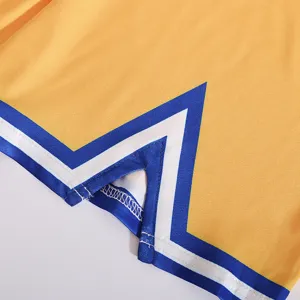 Detailed view of the yellow cheerleader costume hem with blue and white V-stripes design.