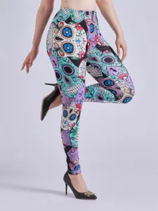 Detailed view of women's high waist stretch leggings featuring vibrant sugar skull prints.