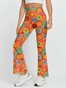 High-waisted retro colorful dotted flare yoga pants detail shot, stretch workout activewear.