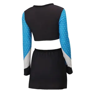 Detailed view of the cheerleading outfit sleeve with blue polka dot print and color blocking.