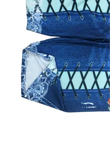 Detailed view of the faux denim print shorts fabric, showing intricate lace and lacing patterns.